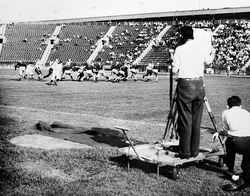 A television camera covers the season’s opener between Fordham University and Waynesburg College during National Broadcasting Company’s first telecast football game in history, at Triborough Stadium on Randall’s Island in New York, on September 30, 1939. (AP Photo )